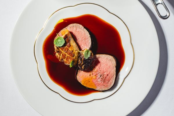 Beef tenderloin steak with grilled duck liver, stuffed morel mushrooms and mashed potatoes