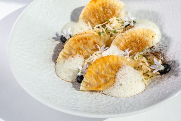 Homemade dumplings with peanut miso, salt baked celeriac and black garlic