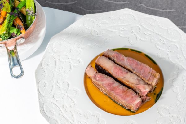 Wagyu rib-eye steak with roasted vegetables and jus